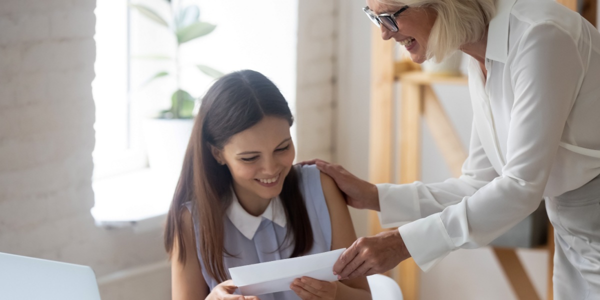 a photo of a young woman receiving a cash incentive via a contingency management program